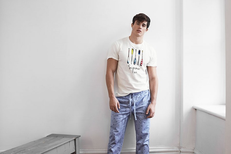 Pietro Boselli wears a graphic t-shirt and lounge pants from LE 31 for Simons.