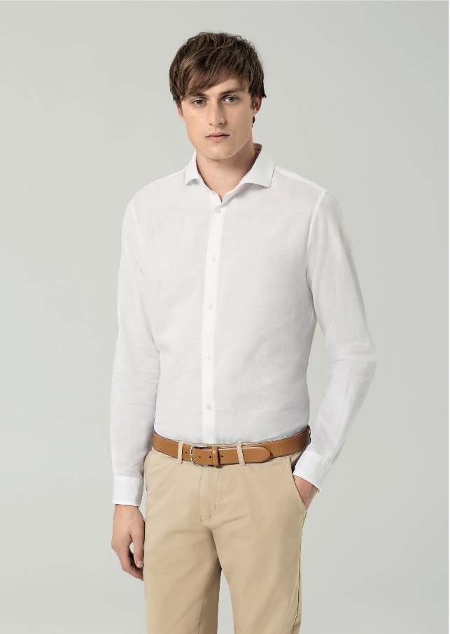 Bastiaan Van Gaalen models a classic white dress shirt with khaki trousers for Premium by Jack & Jones.