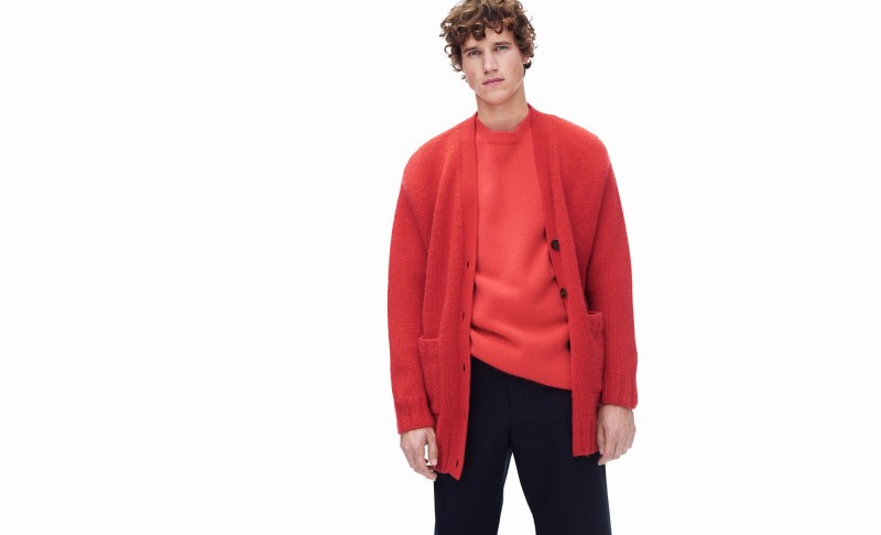 Antoine Renouf wears oversized knit cardigan, longline cashmere sweater and chino trousers Raey. 
