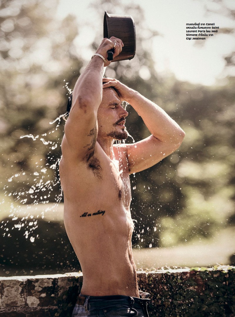Sam Webb washes off in Saint Laurent jeans.