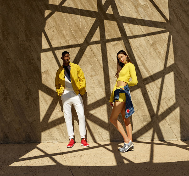 Appearing in Schuh's spring-summer 2016 campaign, Jourdan Copeland goes sporty in a pair of white joggers and red New Balance 574 Fresh Foam sneakers.