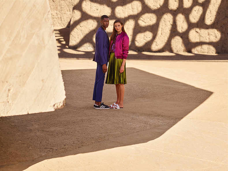 Embracing the suit and sneakers look, Jourdan Copeland wears Adidas Hamburg trainers for Schuh's spring-summer 2016 campaign.