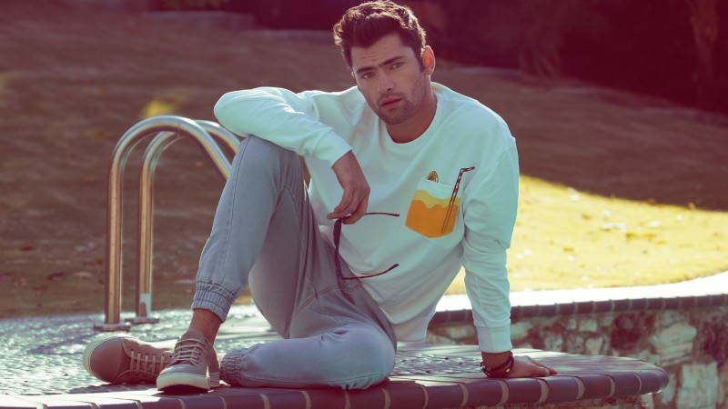 Sean O'Pry relaxes poolside in 1980s inspired styles for Penshoppe's spring 2016 campaign.