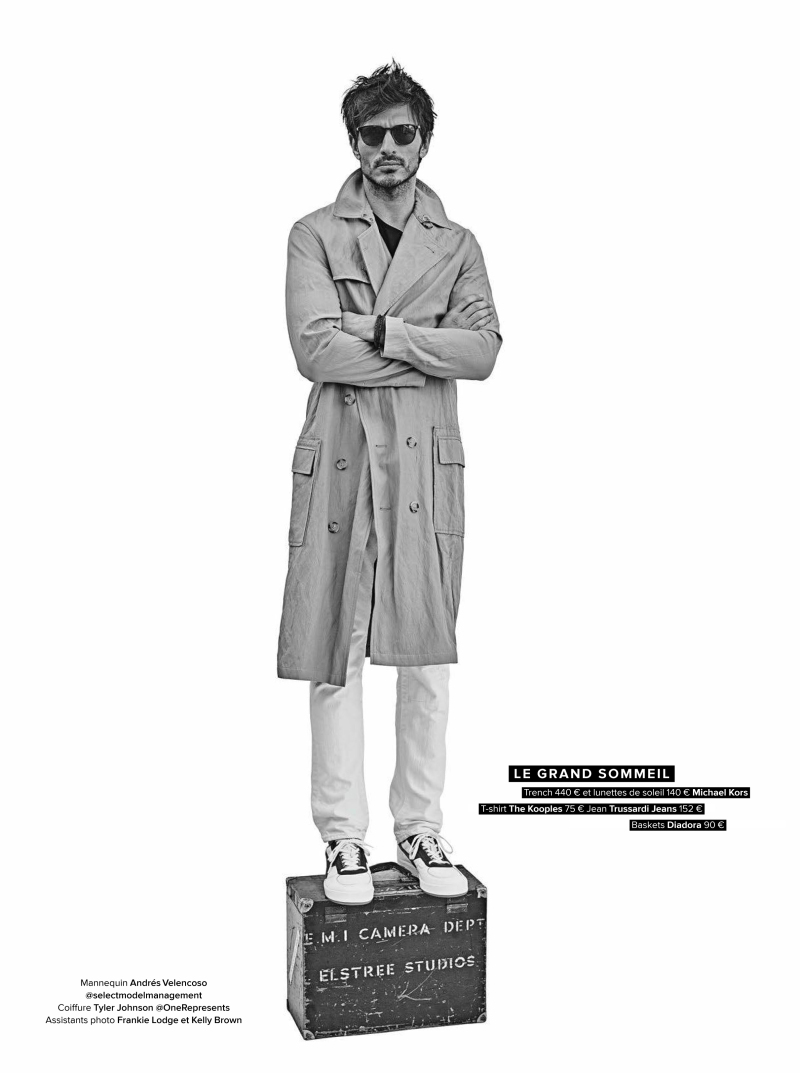 Andres Velencoso Segura dons a trench coat from Michael Kors.