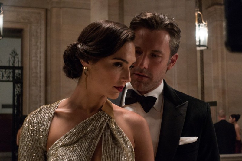 Wearing Gucci, Ben Affleck is Bruce Wayne in Batman v Superman: Dawn of Justice, posing with Gal Gadot as Diana Prince, aka Wonder Woman.