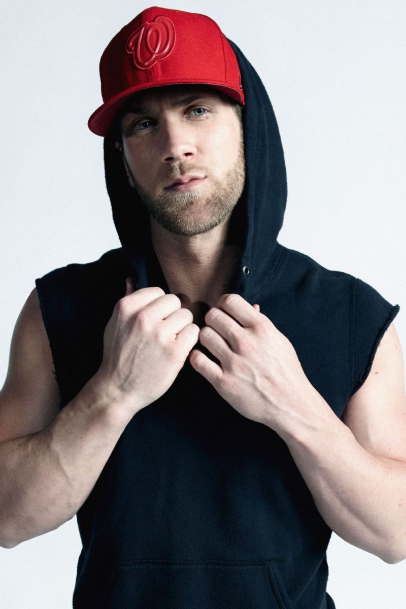 Bryce Harper goes casual in a sleeveless hoodie and cap for ESPN magazine.