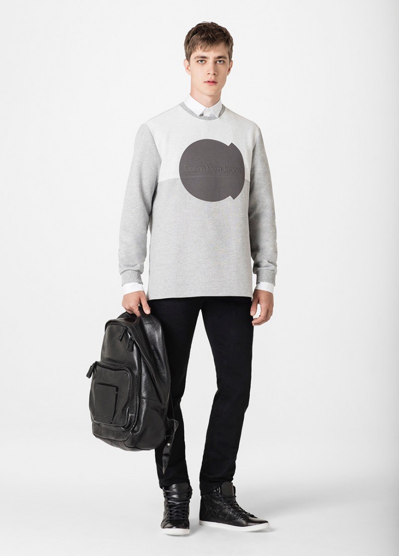 Pedro Bertolini embraces shades of grey in a Calvin Klein Jeans' pullover.