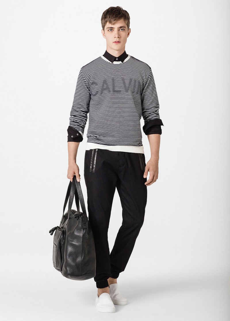 Pedro Bertolini wears a striped Calvin Klein top with black joggers.