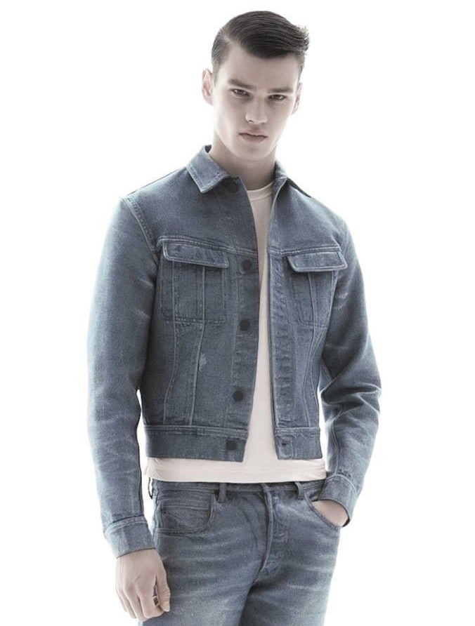 Filip Hrivnak dons a denim jacket and jeans from Calvin Klein Collection's spring-summer 2016 range.