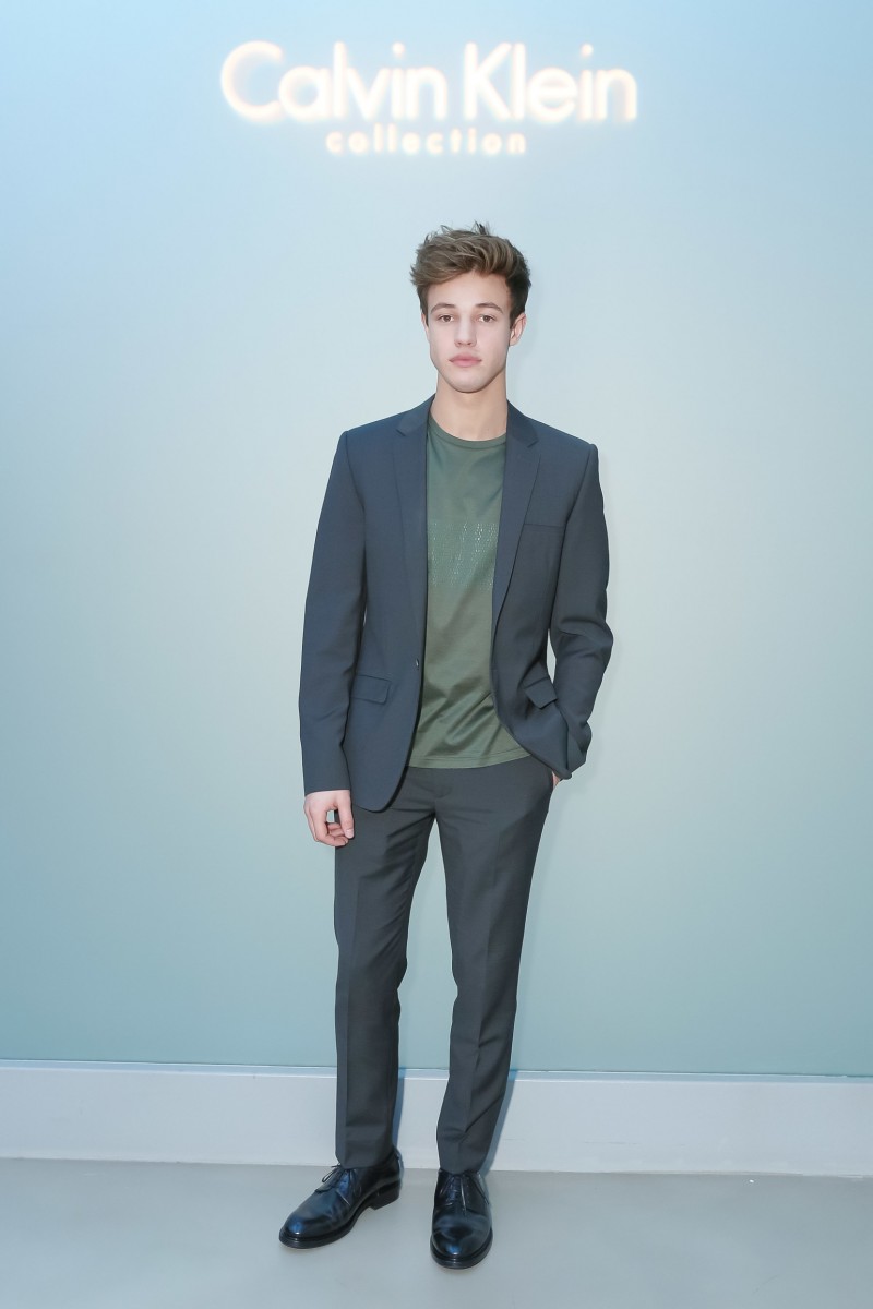 Cameron Dallas poses for pictures at Calvin Klein Collection's fall-winter 2016 show during Milan Fashion Week in January 2016.