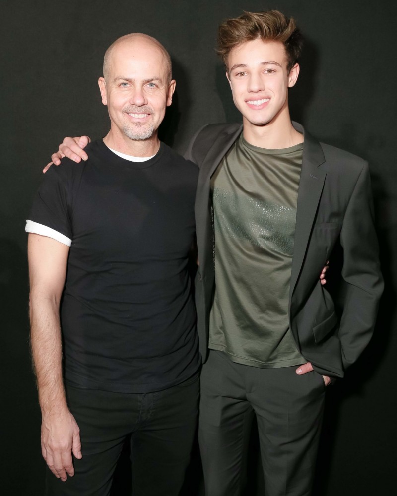 Cameron Dallas poses for a picture with Calvin Klein Collection men's creative director Italo Zucchelli.