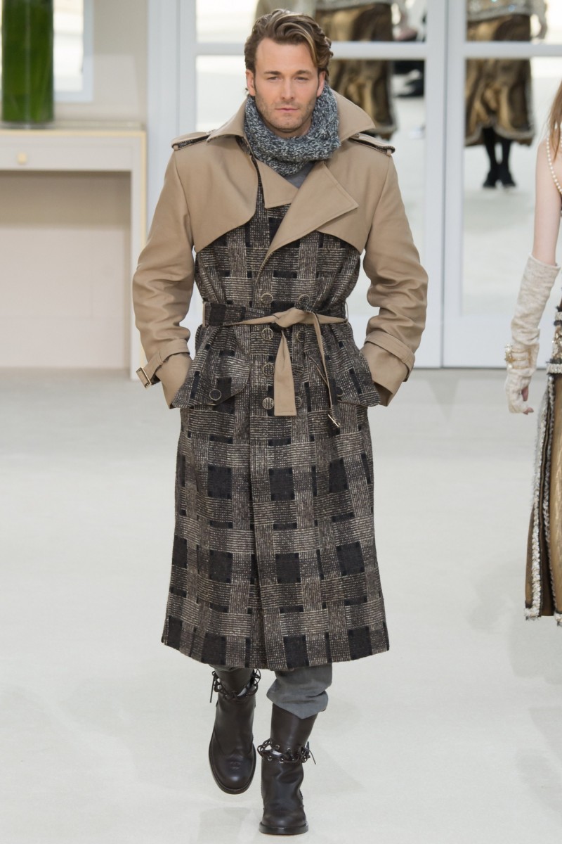 Brad Kroenig takes to the catwalk in a tweed trench from Karl Lagerfeld's fall-winter 2016 Chanel collection.