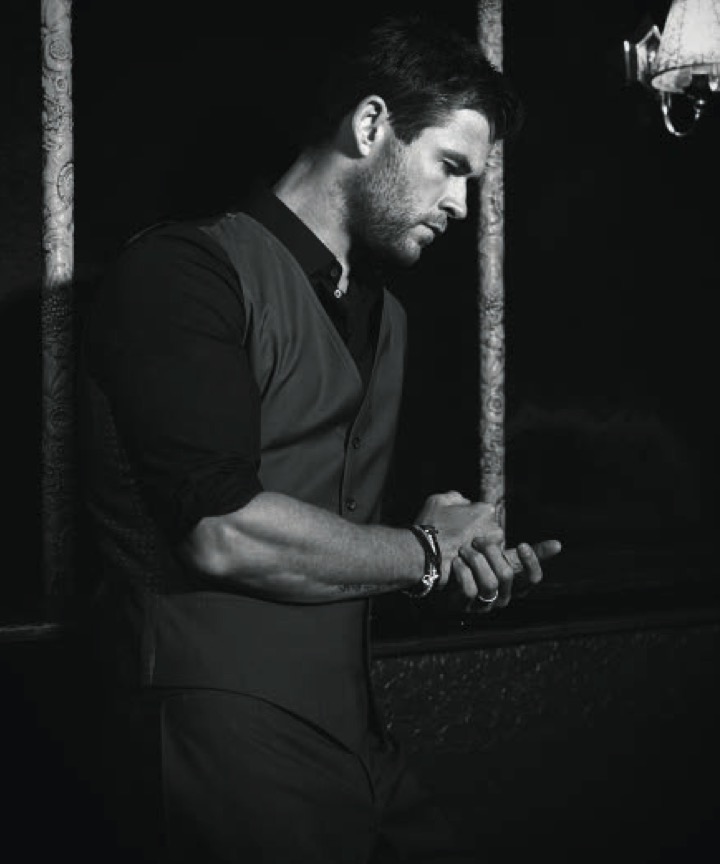 Chris Hemsworth poses for a black & white image for Modern Luxury.