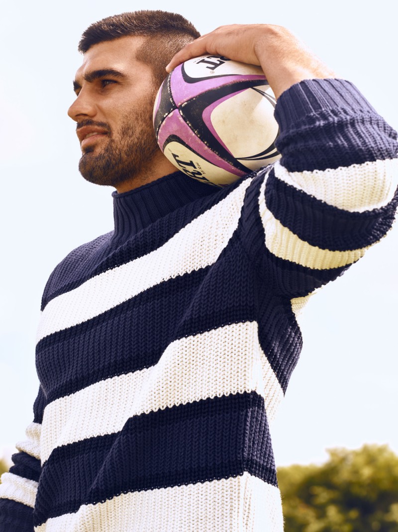 Damian de Allende is styled by Julie Ragolia in an essential navy and white striped sweater.