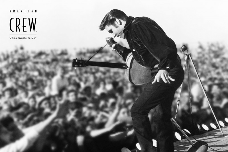 Elvis Presley performs for a crowd of adoring fans.