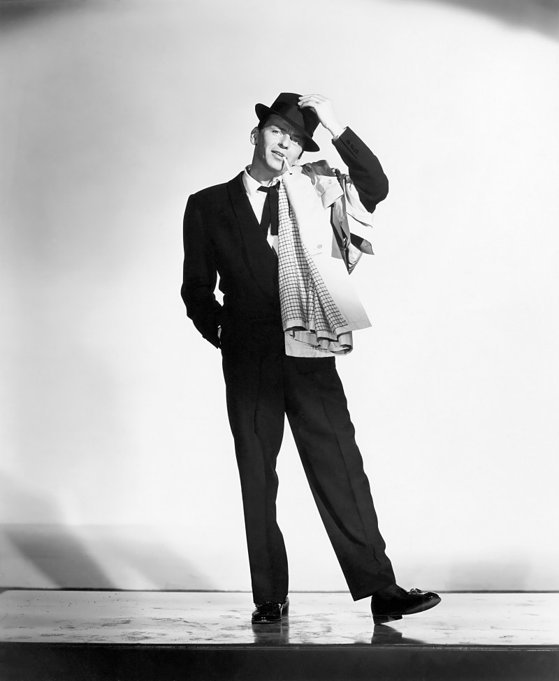 Frank Sinatra dons a black suit and fedora for the 1957 film Pal Joey.
