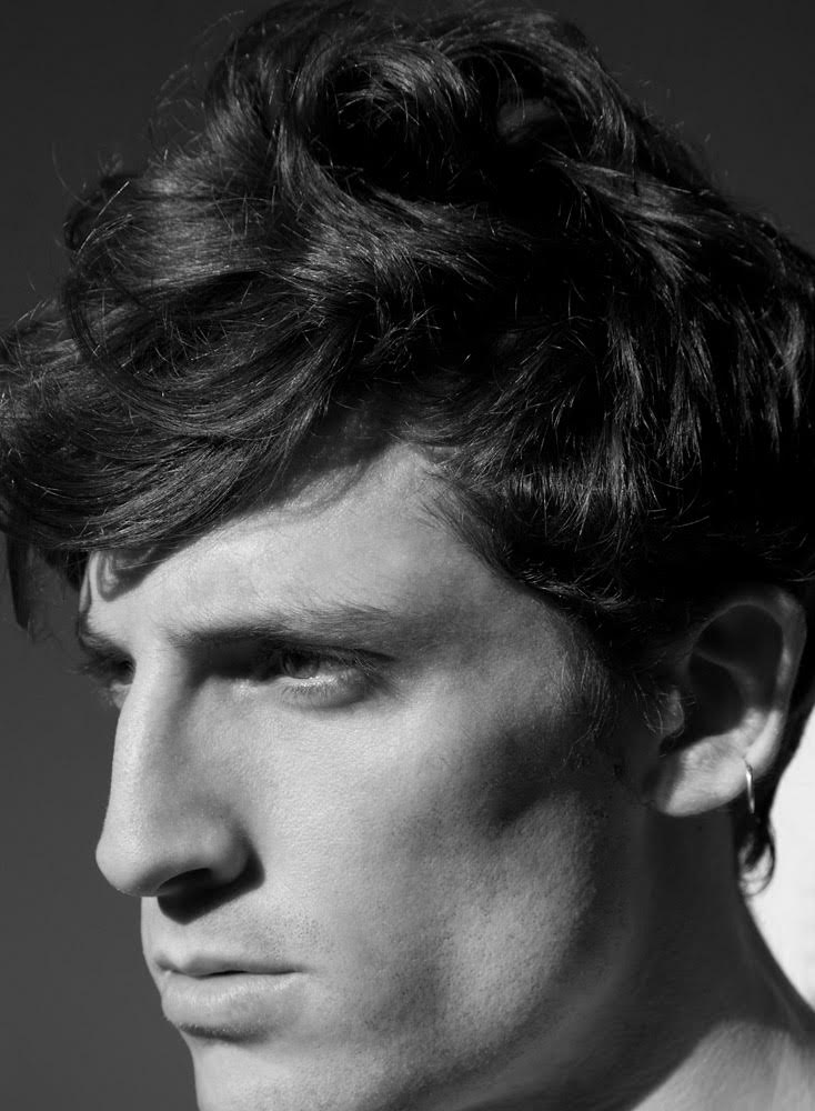 Giovanfrancesco Giannini poses for a black & white portrait by photographer Carlotta Manaigo. 