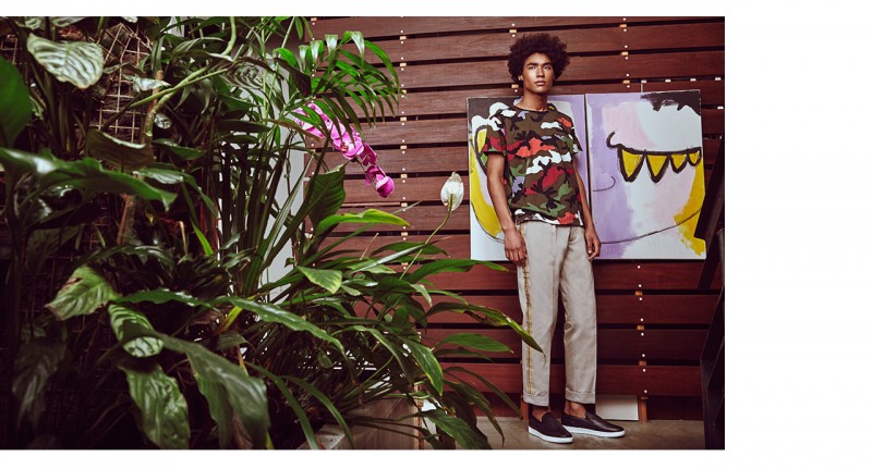 Solomon wears t-shirt Valentino, pants Palm Angels and slip-on sneakers Versace.