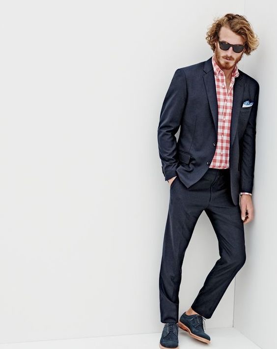 J.Crew men’s Crosby suit jacket with center vent, Secret Wash shirt in heather gingham, Crosby suit pant, Sam sunglasses and Ludlow suede wing tips.