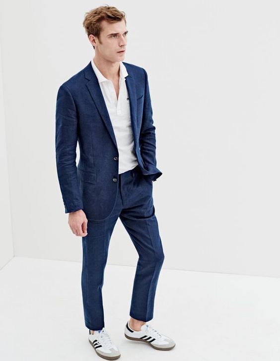 J.Crew men’s Ludlow suit jacket in Irish linen, textured cotton tipped polo shirt, Ludlow suit pant in Irish linen and Adidas® Samba® sneakers.