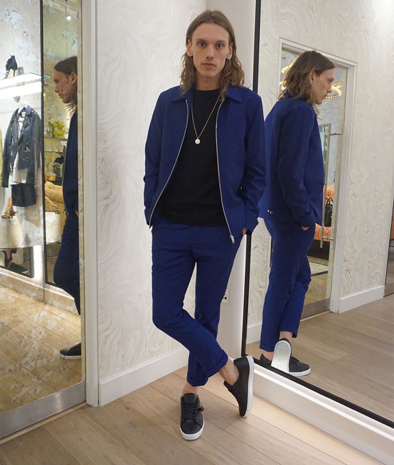 Jamie Campbell Bower goes casual in a black and blue ensemble from River Island.