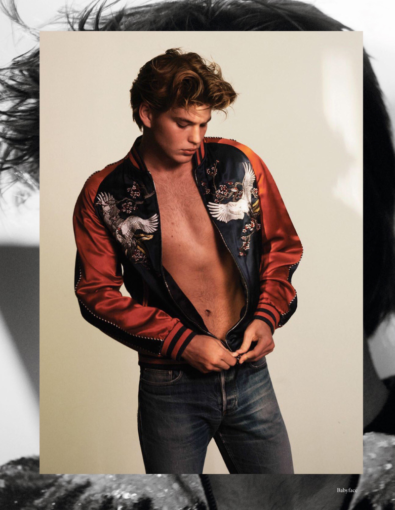 Jordan Barrett models a Louis Vuitton satin souvenir jacket.