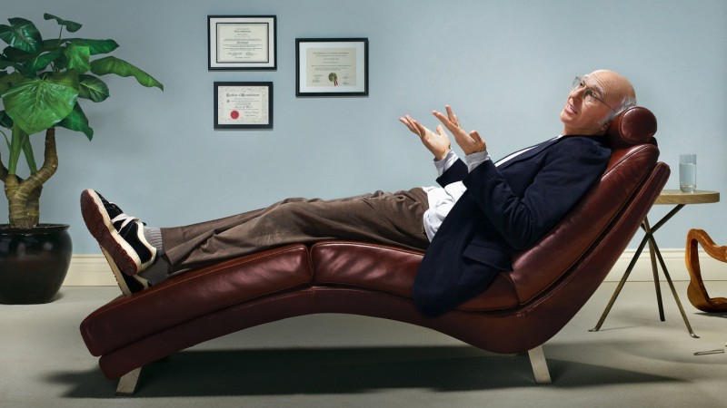 Larry David relaxes in Simple OS black sneakers.