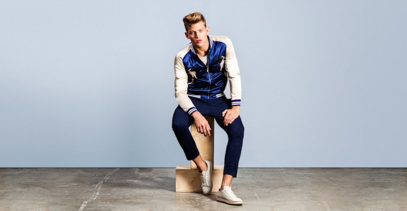 Model Sebastian Sauve dons Lord & Taylor's Laboratory satin embroidered souvenir jacket.