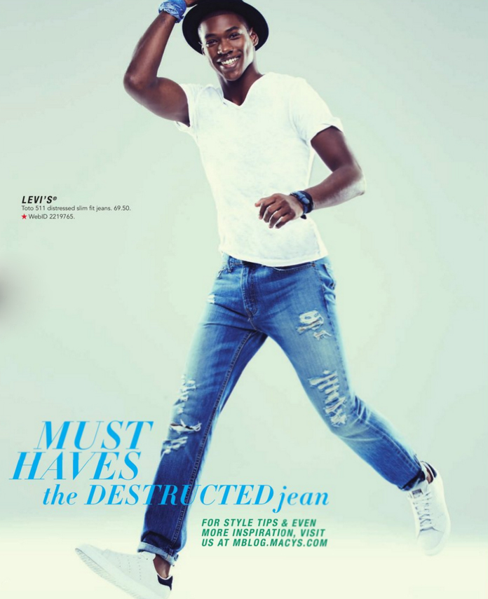 Ronald Epps goes casual in distressed denim jeans from Levi's.