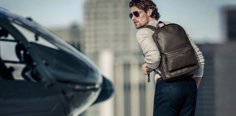 Pictured with a leather backpack, model Wouter Peelen stars in Michael Kors' spring-summer 2016 campaign.