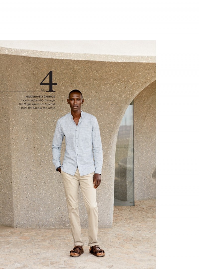 Armando Cabral wears AG straight leg chinos with a button-down shirt.
