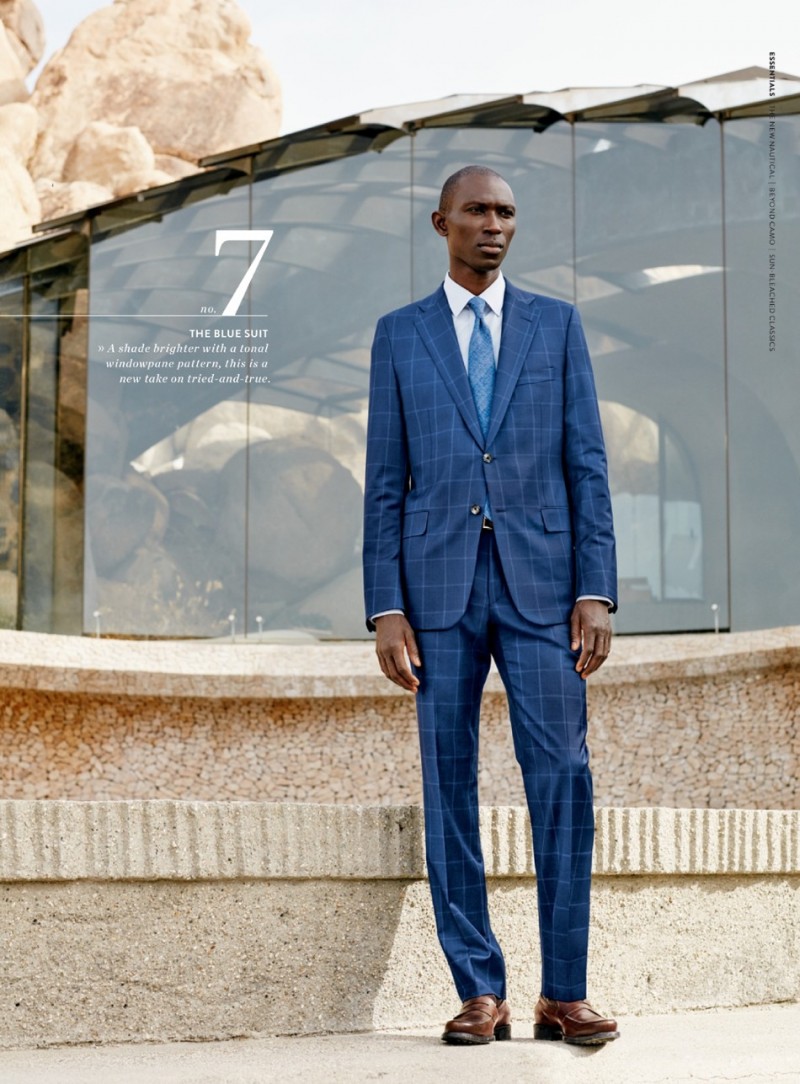 Armando Cabral wears a navy windowpane suit from Hickey Freeman with Tod's penny loafers.