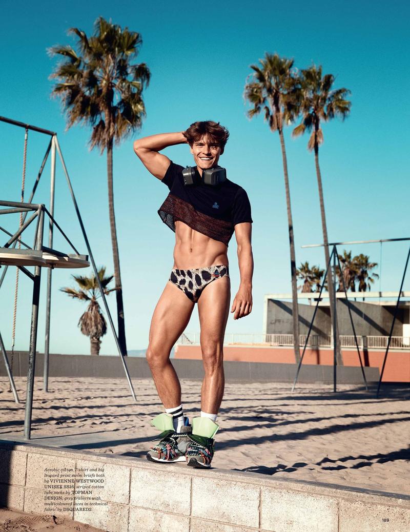 Oliver Cheshire wears a cut-off shirt and swimsuit from Vivienne Westwood.