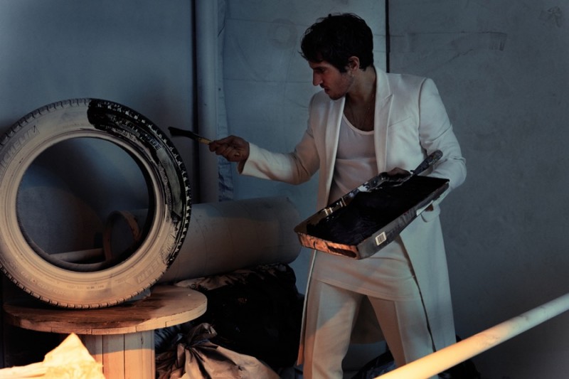 Quim Gutiérrez is photographed in a white tailored look from Givenchy.