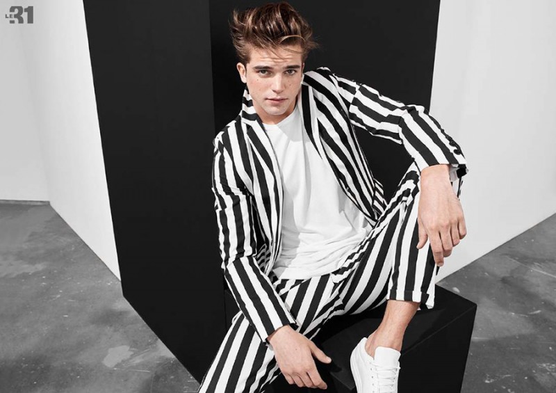 River Viiperi dons a statement black & white striped suit.
