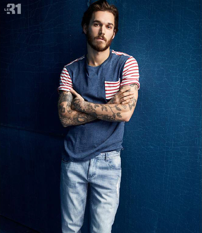 David Alexander Flinn sports a pocket tee from LE 31 that has been updated with playful stripes.