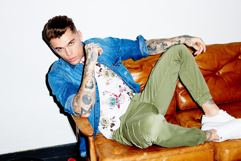 Stephen James sports green joggers with a denim shirt and graphic tee for THEO Wormland's spring-summer 2016 campaign.