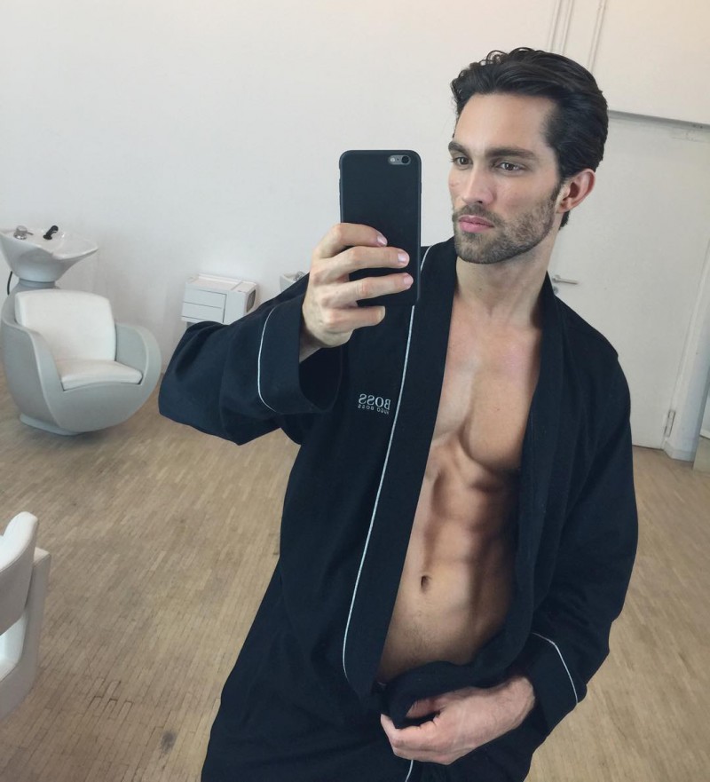 A face of Hugo Boss, Tobias Sorensen takes a selfie in one of the brand's luxe robes.