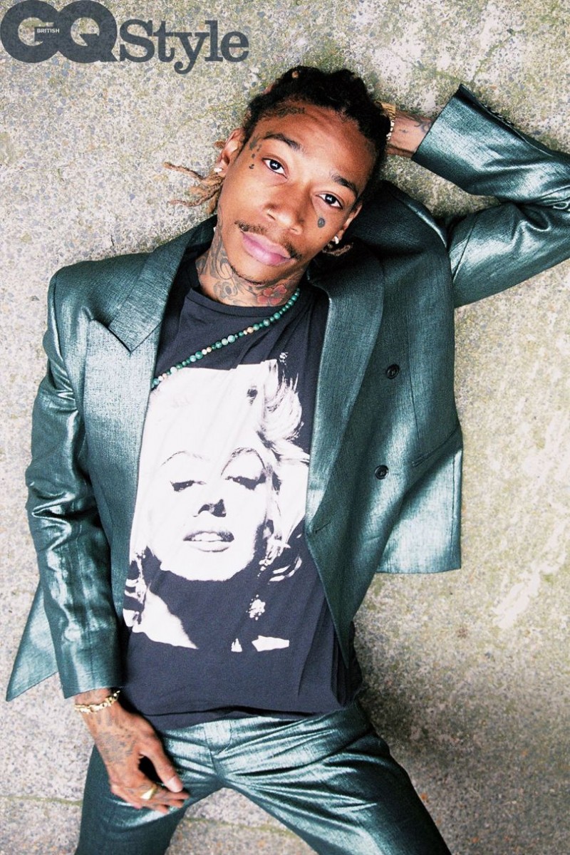 Donning a Paul Smith suit with a Dries Van Noten Marilyn Monroe t-shirt, Wiz Khalifa relaxes for a photo in British GQ.