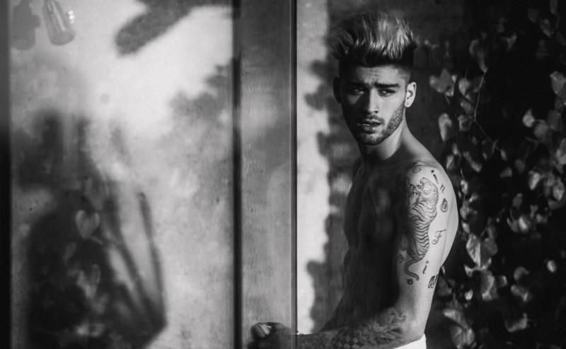 Zayn Malik goes shirtless for his Complex photo shoot, showing off his tattoos.