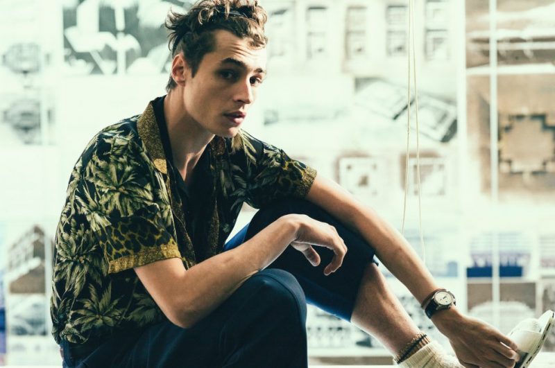 Pictured in Marni trousers, Adrien Sahores makes quite the style statement in a palm tree and leopard print short-sleeve shirt from Dries Van Noten.