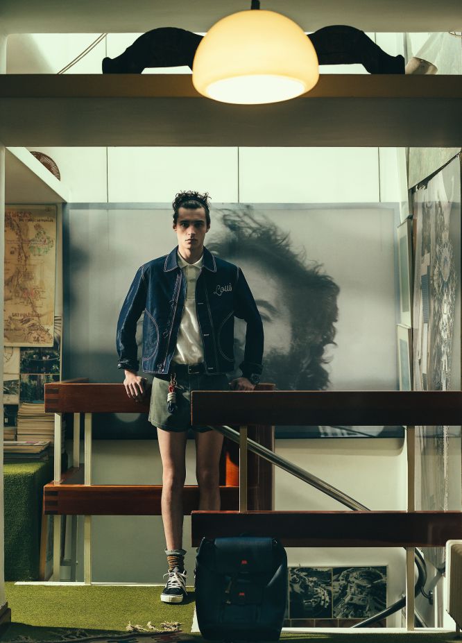 Adrien Sahores dons designer proportions in a Louis Vuitton jacket, Lacoste polo shirt, Prada shorts and Vans sneakers.