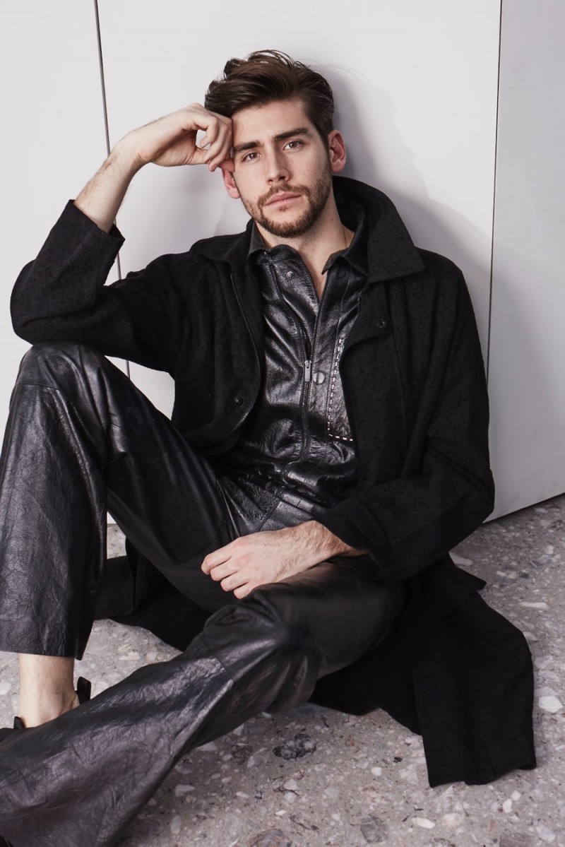Alvaro Soler poses in a linen trench coat and leater tracksuit from Fendi.