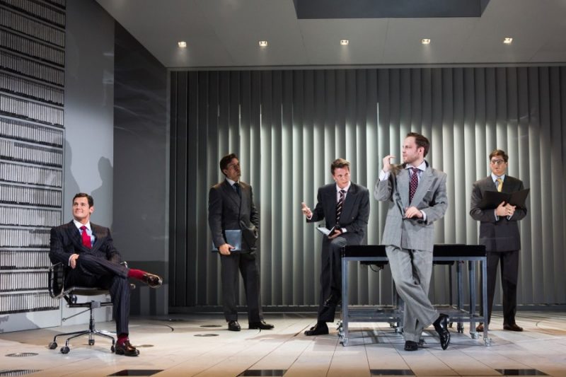 Patrick Bateman (Benjamin Walker) takes to the office in a dashing pinstripe suit, accented with a red tie and socks for American Psycho: The Musical.