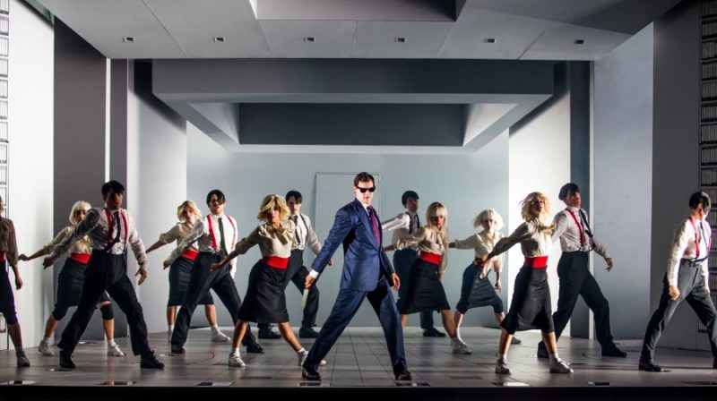 Benjamin Walker suits up in navy for a dance number as Patrick Bateman in American Psycho: The Musical.