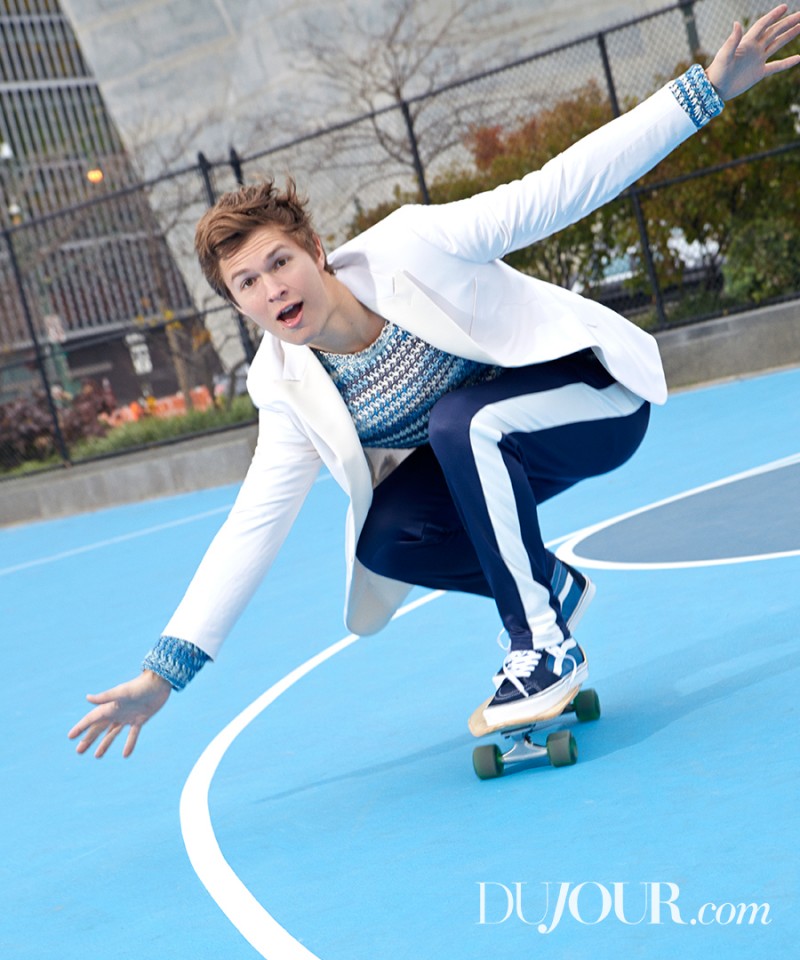 Ansel Elgort wears dinner jacket Hickey Freeman, sweater Belstaff, trackpants Ami and sneakers Vans.