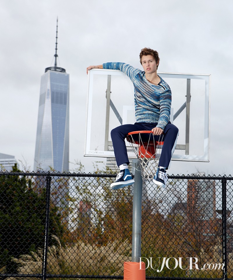 Ansel Elgort wears sweater Belstaff, trackpants Ami, socks Nike and sneakers Vans.