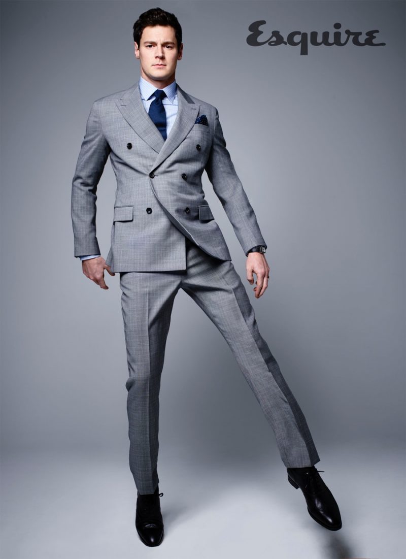 Benjamin Walker dons a grey double-breasted suit for an Esquire photo shoot.