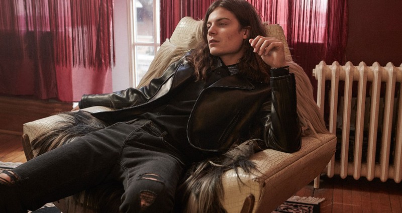 BØRNS wears shirt Alexander McQueen, jeans and leather biker jacket Saint Laurent. 