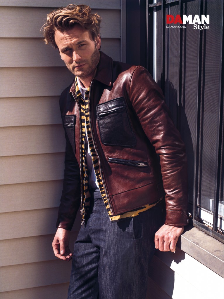 Brad Kroenig makes a luxe statement in leopard and a leather jacket from Coach.